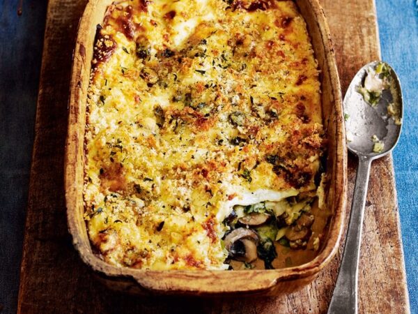 Kale, leek and mushroom lasagne with blue cheese topping
