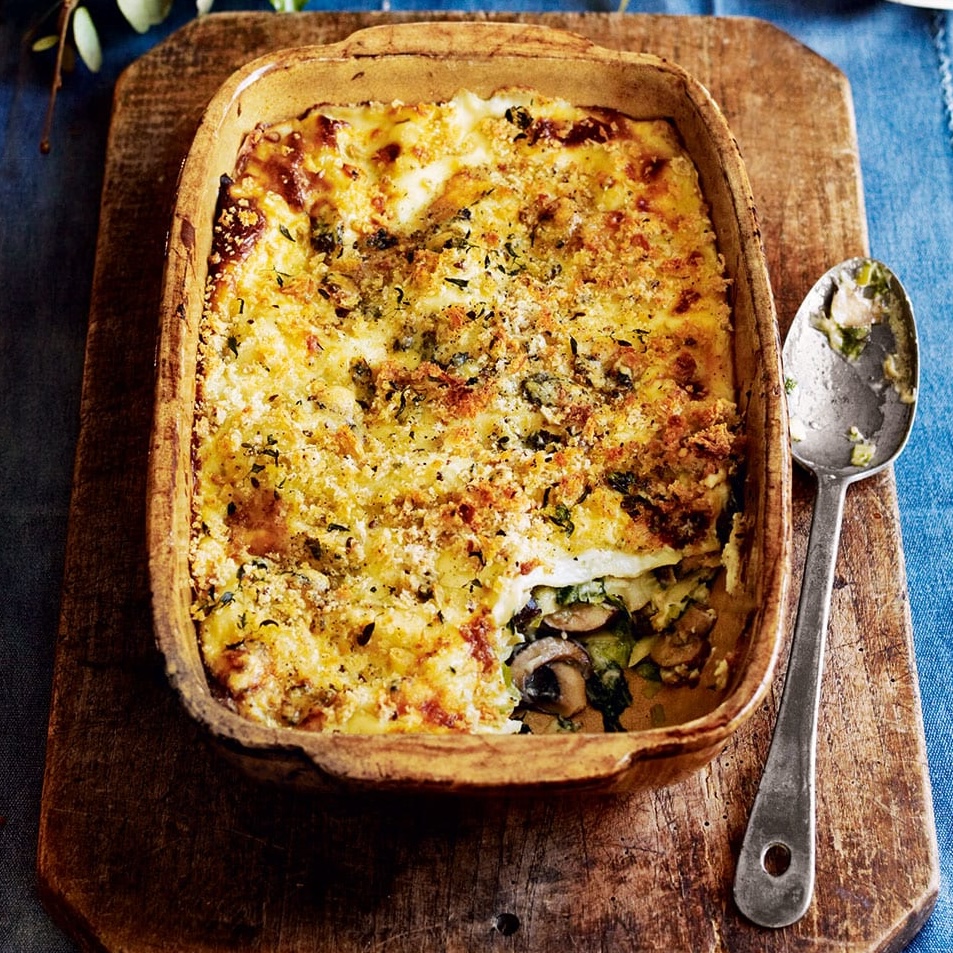 Kale, leek and mushroom lasagne with blue cheese topping